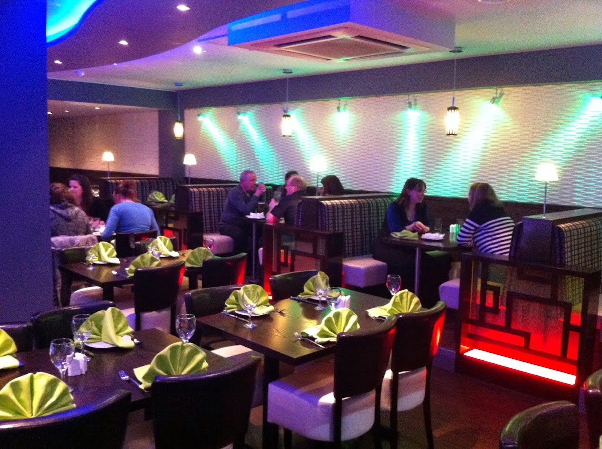 Appayon restaurant dining room with booth seating and tables set for dinner