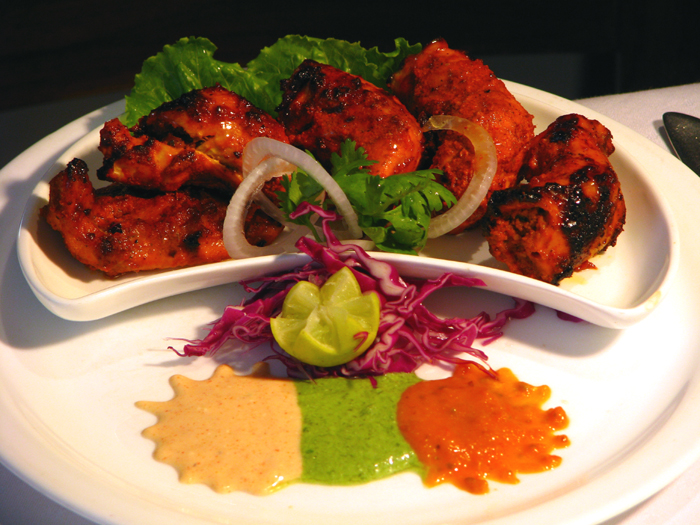 Appayon chicken tikka with salad, lime and three colourful sauces